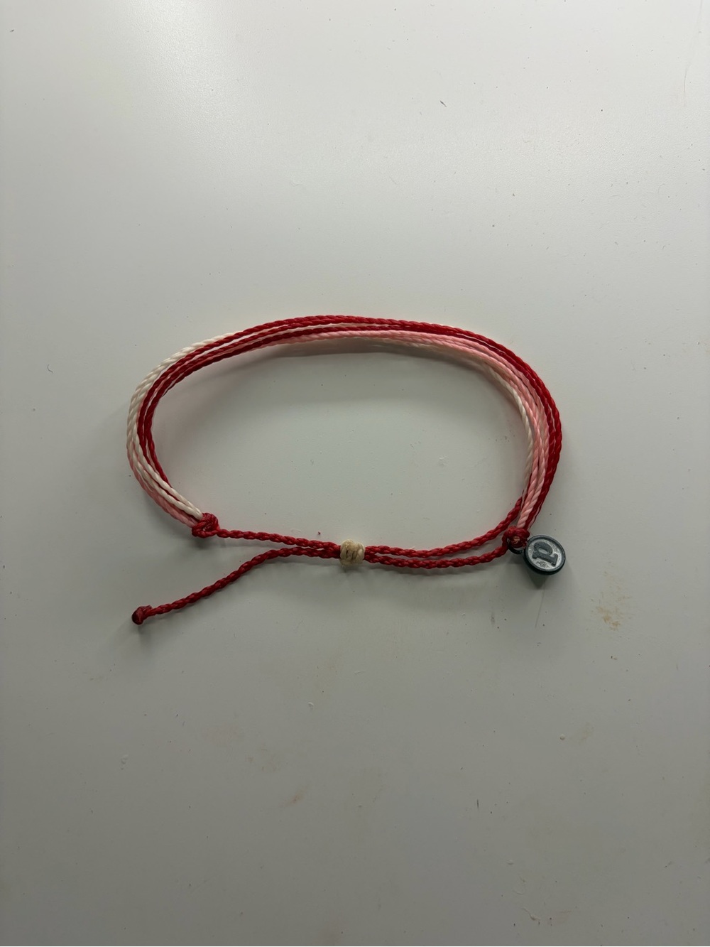 Pura Vida Red and Light Pink Woven Friendship Bracelet